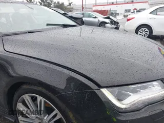 2014 Audi A7 3.0 Prestige with VIN WAU2GAFC5EN090233, listed as a IAAI auction lot 41565942 with 199,890 mi miles. Bid and sale history available at carsss.com. Image 19.
