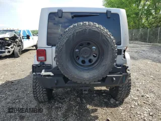 2014 Jeep Wrangler Sahara with VIN 1C4AJWBG0EL241643, listed as a Copart auction lot 56491155 with 113,596 mi miles and Salvage title. Bid and sale history available at DreamBid. Image 6.