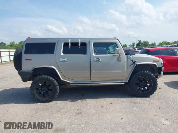 2004 Hummer H2 z VIN 5GRGN23U34H105809, wystawiony jako IAAI lot #42456055 z przebiegiem Nie podano mil oraz . Historia ofert i sprzedaży dostępna na DreamBid. Obrazek 13.