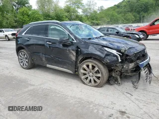 2020 Cadillac XT4 FWD Premium Luxury with VIN 1GYFZCR46LF113499, listed as a Copart auction lot 57534205 with 64,859 mi miles and Salvage title. Bid and sale history available at DreamBid. Image 4.