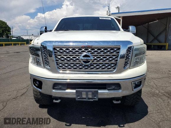 2016 Nissan Titan Platinum Reserve z VIN 1N6BA1F41GN504539, wystawiony jako Copart lot #64812975 z przebiegiem 143 144 mil mil oraz Szkoda całkowita • Salvage title. Historia ofert i sprzedaży dostępna na DreamBid. Obrazek 5.
