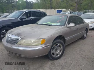 2000 Lincoln Continental with VIN 1LNHM97V3YY874672, listed as a IAAI auction lot 41970533 with 151,915 mi miles. Bid and sale history available at carsss.com. Image 2.