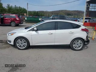 2017 Ford Focus Titanium with VIN 1FADP3N24HL331009, listed as a IAAI auction lot 42029193 with 82,068 mi miles and . Bid and sale history available at carsss.com. Image 14.