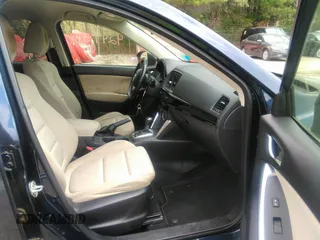2014 Mazda CX-5 Touring z VIN JM3KE2CYXE0429149, wystawiony jako IAAI lot #42471772 z przebiegiem 222 440 mil mil oraz . Historia ofert i sprzedaży dostępna na DreamBid. Obrazek 5.