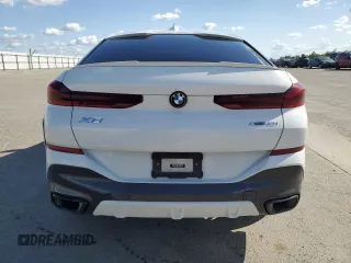 2023 BMW X6 xDrive40i z VIN 5UXCY6C04P9P49005, wystawiony jako Copart lot #51974695 z przebiegiem 30 421 mil mil oraz Szkoda całkowita • Salvage title. Historia ofert i sprzedaży dostępna na DreamBid. Obrazek 6.