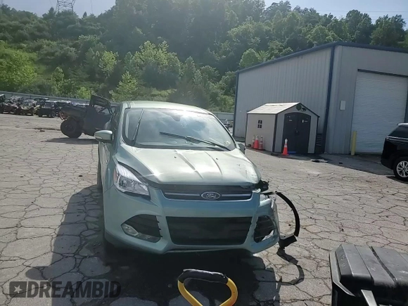 2013 Ford Escape SEL z VIN 1FMCU9H98DUC56048, wystawiony jako Copart lot #61613085 z przebiegiem 198 102 mil mil oraz Szkoda całkowita • Salvage title. Historia ofert i sprzedaży dostępna na DreamBid. Obrazek 14.