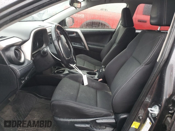 2018 Toyota RAV4 XLE with VIN JTMRFREV0JJ200337, listed as a Copart auction lot 84901594 with 57,301 mi miles and Salvage Title. Bid and sale history available at DreamBid. Image 7.