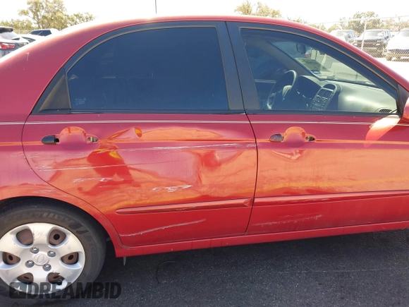 2009 Kia Spectra EX with VIN KNAFE221195606045, listed as a IAAI auction lot 41764519 with 124,577 mi miles. Bid and sale history available at carsss.com. Image 6.