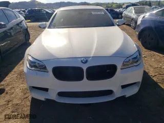 2015 BMW M5 with VIN WBSFV9C51FD594308, listed as a Copart auction lot 43259104 with 73,158 mi miles. Bid and sale history available at carsss.com. Image 5.