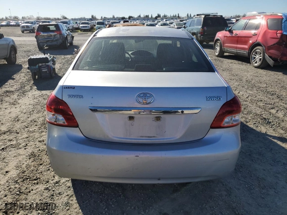2011 Toyota Yaris with VIN JTDBT4K35B1409879, listed as a Copart auction lot 88090195 with 133,900 mi miles and Salvage Title. Bid and sale history available at carsss.com. Image 6.