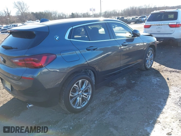 2022 BMW X2 xDrive28i with VIN WBXYJ1C05N5U40472, listed as a IAAI auction lot 41433452 with 67,801 mi miles. Bid and sale history available at carsss.com. Image 4.