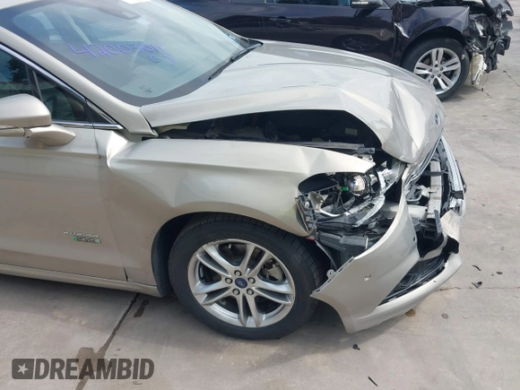 2015 Ford Fusion Energi Titanium with VIN 3FA6P0SU3FR114739, listed as a IAAI auction lot 42003011 with 120,553 mi miles. Bid and sale history available at carsss.com. Image 17.