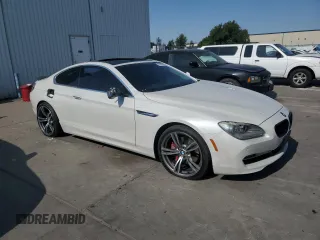 2012 BMW 6 Series 650i xDrive z VIN WBALX5C5XCC894182, wystawiony jako Copart lot #60100065 z przebiegiem 110 187 mil mil oraz Szkoda całkowita • Salvage title. Historia ofert i sprzedaży dostępna na DreamBid. Obrazek 4.