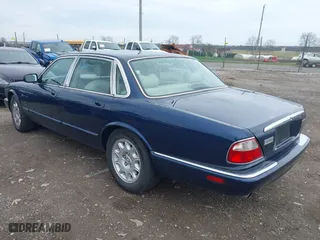 1998 Jaguar XJ with VIN SAJHX124XWC844575, listed as a IAAI auction lot 41951600 with 97,458 mi miles. Bid and sale history available at carsss.com. Image 3.
