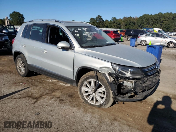 2014 Volkswagen Tiguan SE with VIN WVGAV3AX9EW611860, listed as a Copart auction lot 74431754 with 116,022 mi miles and Salvage title. Bid and sale history available at DreamBid. Image 4.