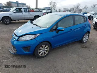 2013 Ford Fiesta SE with VIN 3FADP4EJ6DM130511, listed as a IAAI auction lot 41757636 with 153,664 mi miles. Bid and sale history available at carsss.com. Image 2.