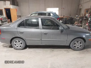 2004 Hyundai Accent GL with VIN KMHCG45C44U528783, listed as a IAAI auction lot 41535104 with 1 mi miles. Bid and sale history available at carsss.com. Image 13.