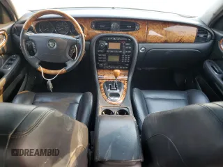 2004 Jaguar XJ with VIN SAJWA73B74TG18082, listed as a Copart auction lot 70516404 with 0 mi miles and Salvage Title. Bid and sale history available at carsss.com. Image 8.