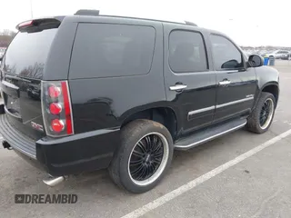 2012 GMC Yukon Denali with VIN 1GKS2EEF5CR129160, listed as a IAAI auction lot 42012417 with 221,871 mi miles. Bid and sale history available at carsss.com. Image 4.