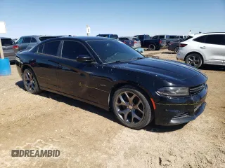 2015 Dodge Charger RT with VIN 2C3CDXCT0FH805909, listed as a Copart auction lot 42612035 with 77,493 mi miles and Salvage title. Bid and sale history available at DreamBid. Image 4.