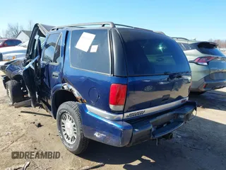 1999 GMC Jimmy SLE with VIN 1GKDT13W3X2553792, listed as a IAAI auction lot 41876489 with 266,884 mi miles. Bid and sale history available at carsss.com. Image 3.