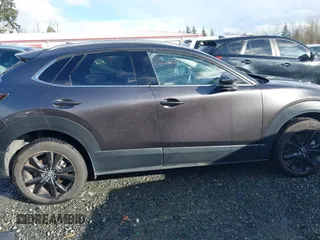 2021 Mazda CX-30 Premium with VIN 3MVDMBDY2MM239231, listed as a IAAI auction lot 41655159 with 22,679 mi miles and . Bid and sale history available at carsss.com. Image 14.