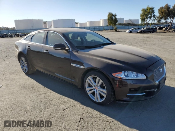 2014 Jaguar XJ with VIN SAJWA1CZ3E8V69877, listed as a Copart auction lot 48159005 with 57,567 mi miles and Clean Title. Bid and sale history available at DreamBid. Image 4.