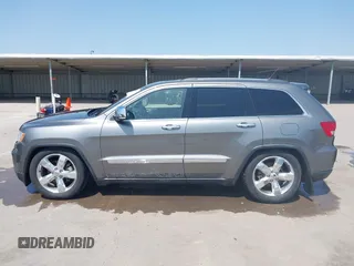 2013 Jeep Grand Cherokee Overland with VIN 1C4RJFCG2DC611877, listed as a IAAI auction lot 41910800 with 151,457 mi miles. Bid and sale history available at carsss.com. Image 14.