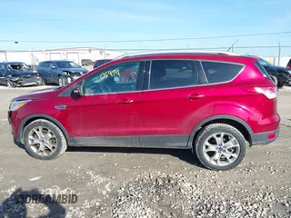 2015 Ford Escape Titanium z VIN 1FMCU9J9XFUC75357, wystawiony jako IAAI lot #41705474 z przebiegiem 198 381 mil mil oraz . Historia ofert i sprzedaży dostępna na DreamBid. Obrazek 14.