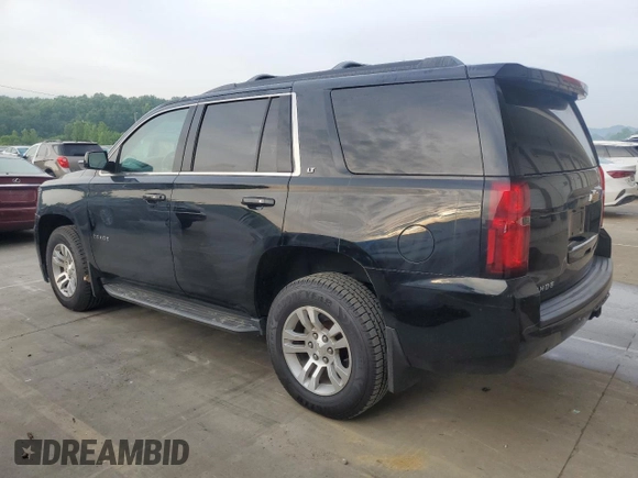 2019 Chevrolet Tahoe LT with VIN 1GNSKBKC2KR349527, listed as a Copart auction lot 58496695 with 128,590 mi miles and Salvage title. Bid and sale history available at DreamBid. Image 2.