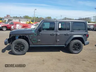 2021 Jeep Wrangler Unlimited Willys with VIN 1C4HJXDG1MW672507, listed as a IAAI auction lot 42084805 with 59,943 mi miles and . Bid and sale history available at DreamBid. Image 14.
