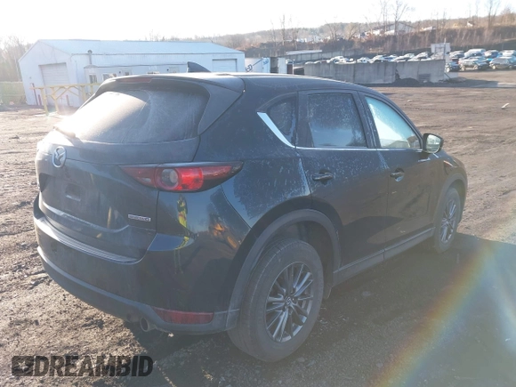 2021 Mazda CX-5 Touring with VIN JM3KFBCM2M1303063, listed as a IAAI auction lot 41814604 with 36,116 mi miles. Bid and sale history available at carsss.com. Image 4.