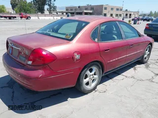 2003 Ford Taurus SES Standard with VIN 1FAFP55243G191713, listed as a IAAI auction lot 42145771 with 232,282 mi miles. Bid and sale history available at carsss.com. Image 4.