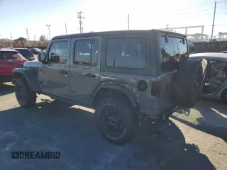 2020 Jeep Wrangler Unlimited Willys with VIN 1C4HJXDG5LW348507, listed as a Copart auction lot 77000574 with 57,056 mi miles and Salvage title. Bid and sale history available at DreamBid. Image 2.
