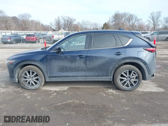2018 Mazda CX-5 Grand Touring with VIN JM3KFBDM7J0338665, listed as a IAAI auction lot 41546019 with 141,740 mi miles. Bid and sale history available at carsss.com. Image 14.