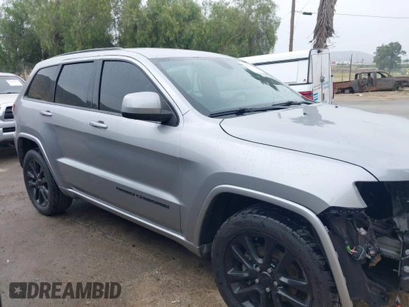 2017 Jeep Grand Cherokee Laredo with VIN 1C4RJEAG0HC702195, listed as a IAAI auction lot 42427597 with 104,403 mi miles and . Bid and sale history available at DreamBid. Image 14.