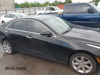 2014 Cadillac ATS Luxury AWD z VIN 1G6AH5R30E0150854, wystawiony jako IAAI lot #42422421 z przebiegiem 96 713 mil mil oraz . Historia ofert i sprzedaży dostępna na DreamBid. Obrazek 13.