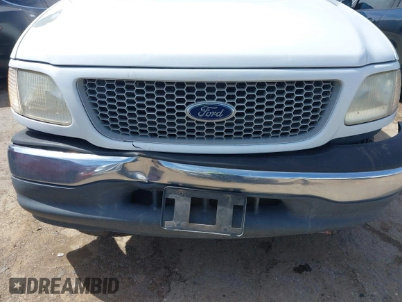 1999 Ford F-150 with VIN 1FTZX1720XKB31945, listed as a IAAI auction lot 42123984 with 187,766 mi miles and . Bid and sale history available at DreamBid. Image 18.