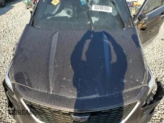 2021 Cadillac XT4 FWD Premium Luxury z VIN 1GYFZCR45MF002654, wystawiony jako Copart lot #52288105 z przebiegiem Nie podano mil oraz Szkody całkowita. Historia ofert i sprzedaży dostępna na DreamBid. Obrazek 13.