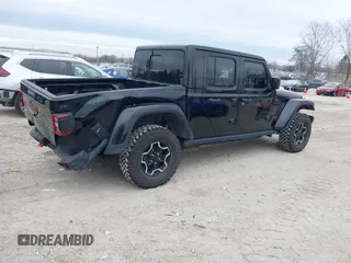 2022 Jeep Gladiator Rubicon with VIN 1C6JJTBG7NL145501, listed as a IAAI auction lot 41506842 with 20,593 mi miles and . Bid and sale history available at DreamBid. Image 4.