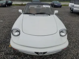 1991 Alfa Romeo Spider z VIN ZARBB32G8M6005213, wystawiony jako Copart lot #74077224 z przebiegiem Nie podano mil oraz Nie do naprawy. Historia ofert i sprzedaży dostępna na DreamBid. Obrazek 5.