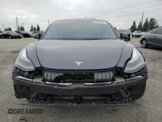 2023 Tesla Model 3 with VIN 5YJ3E1EA4PF642769, listed as a Copart auction lot 50648825 with 25,310 mi miles and Salvage title. Bid and sale history available at DreamBid. Image 5.
