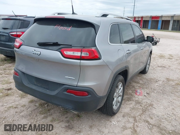 2018 Jeep Cherokee Latitude with VIN 1C4PJLCX4JD559096, listed as a IAAI auction lot 41925282 with 127,488 mi miles and . Bid and sale history available at DreamBid. Image 4.