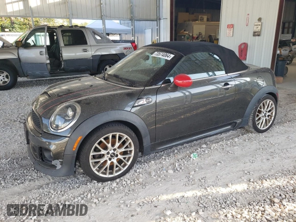 2015 MINI Roadster S z VIN WMWSY3C59FT566785, wystawiony jako Copart lot #73574064 z przebiegiem 96 623 mil mil oraz Tytuł czysty. Historia ofert i sprzedaży dostępna na DreamBid. Obrazek 1.