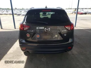 2016 Mazda CX-5 Touring z VIN JM3KE2CY4G0805072, wystawiony jako Copart lot #58435535 z przebiegiem 146 323 mil mil oraz Szkoda całkowita • Salvage title. Historia ofert i sprzedaży dostępna na DreamBid. Obrazek 6.