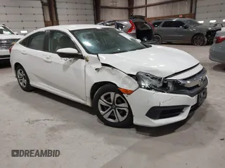 2017 Honda Civic LX z VIN 19XFC2F59HE229666, wystawiony jako IAAI lot #42274054 z przebiegiem 92 075 mil mil oraz . Historia ofert i sprzedaży dostępna na DreamBid. Obrazek 1.