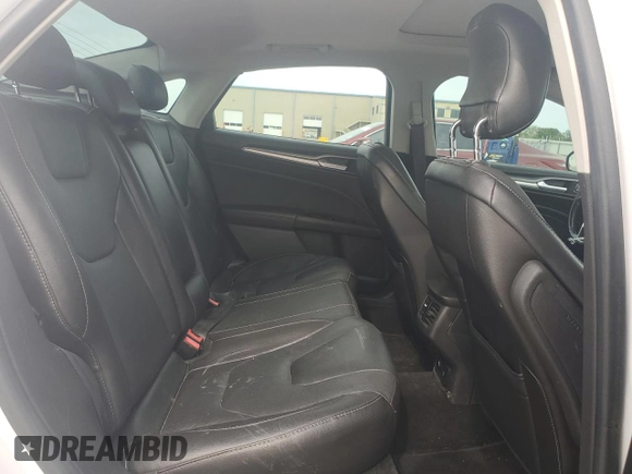 2013 Ford Fusion Titanium Hybrid с VIN 3FA6P0RU3DR282013, выставлен на аукционе Copart как лот 53651595 с пробегом 133 214 миль миль и Списание • Salvage title. История ставок и продаж доступна на DreamBid. Изображение 10.