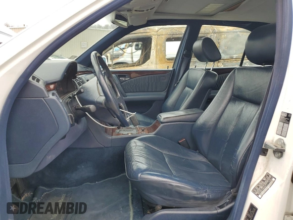 1996 Mercedes-Benz E-Class with VIN WDBJF55F5TJ022277, listed as a Copart auction lot 52597985 with 213,848 mi miles and Clean Title. Bid and sale history available at carsss.com. Image 7.