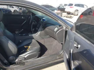 2012 Hyundai Genesis Coupe Grand Touring with VIN KMHHU6KH8CU068486, listed as a IAAI auction lot 41686499 with 104,579 mi miles and . Bid and sale history available at DreamBid. Image 5.