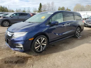 2018 Honda Odyssey Elite z VIN 5FNRL6H93JB012909, wystawiony jako Copart lot #52410845 z przebiegiem 156 735 mil mil oraz Czysty tytuł • Clean title. Historia ofert i sprzedaży dostępna na DreamBid. Obrazek 1.